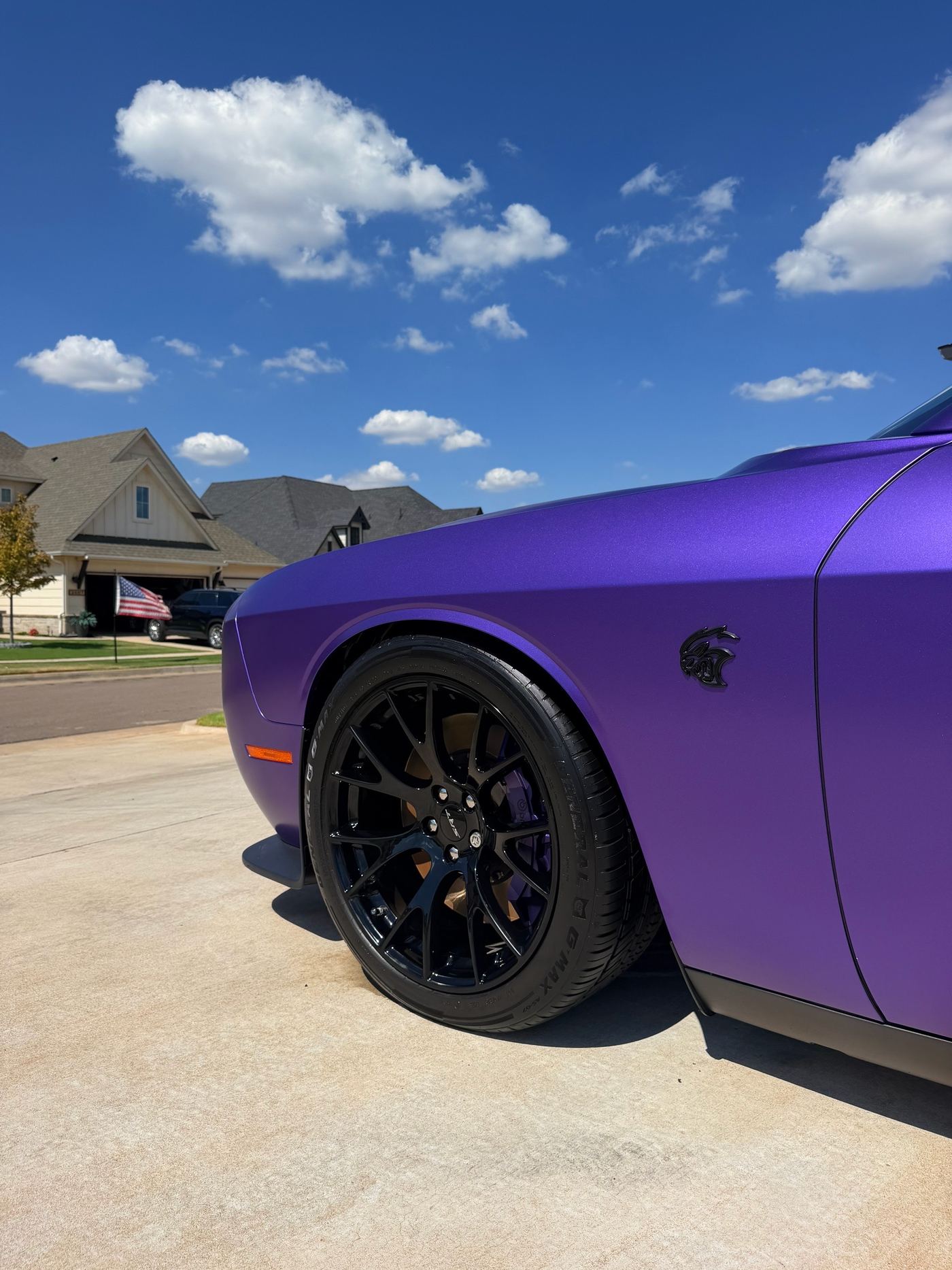 Polished paint and wheel detail on a Dodge Challenger SRT